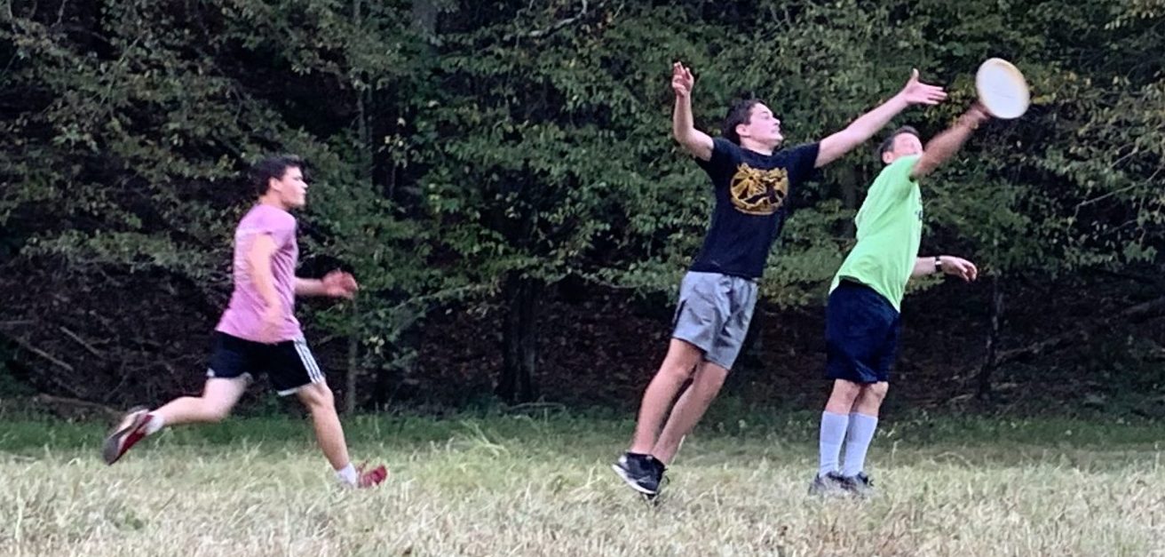 Fall Retreat Picture Boys playing frisbee